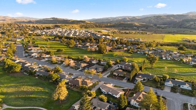 birds eye view of property with a mountain view