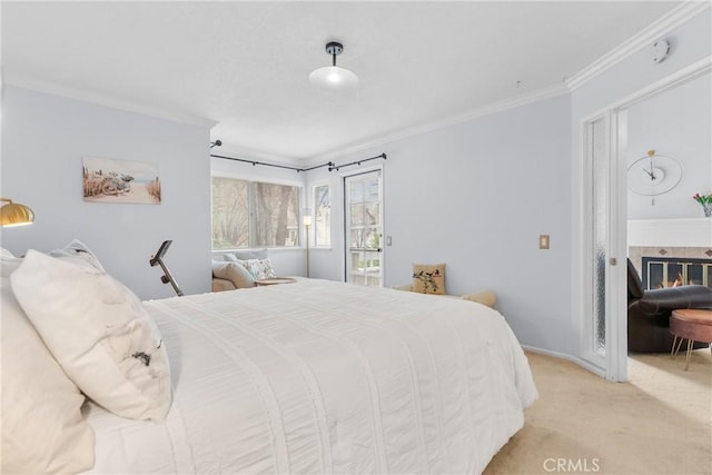 carpeted bedroom featuring crown molding and a fireplace