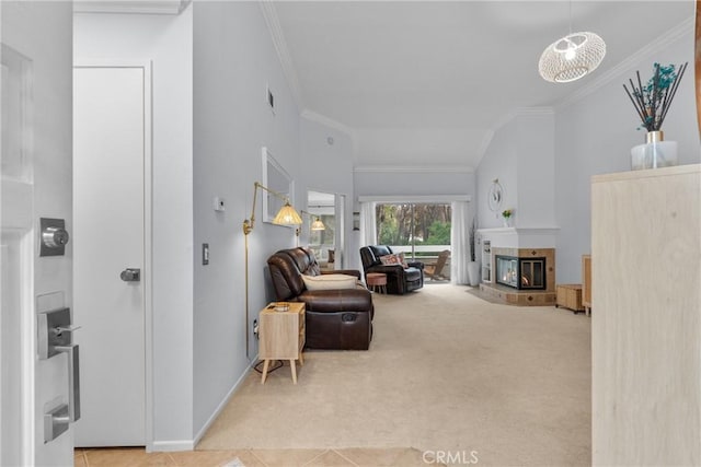 carpeted living room featuring crown molding and a tile fireplace