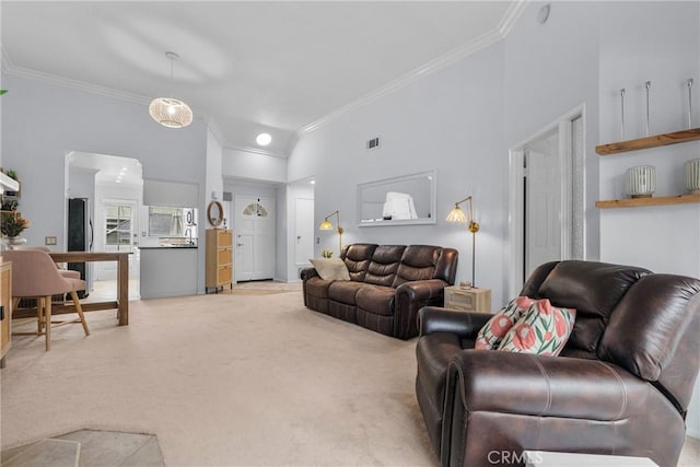 carpeted living room featuring ornamental molding and a towering ceiling