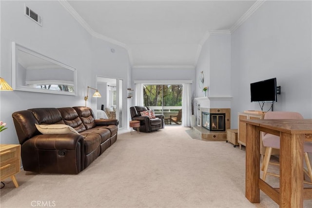 living room with crown molding, carpet flooring, high vaulted ceiling, and a tile fireplace