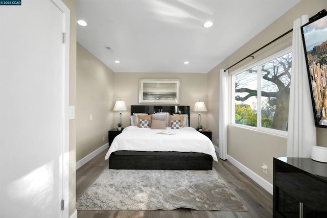 bedroom featuring dark hardwood / wood-style flooring