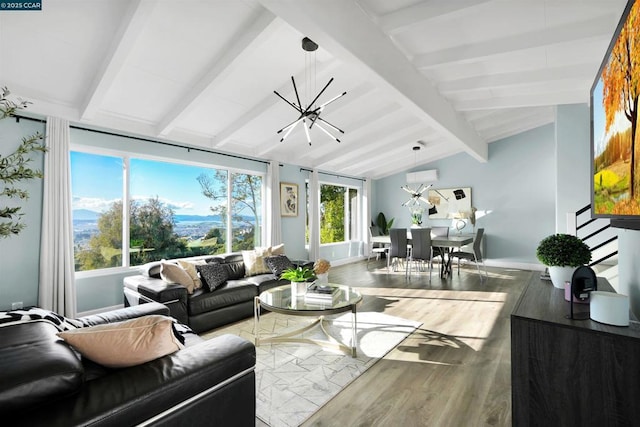 living room with lofted ceiling with beams, hardwood / wood-style floors, and a notable chandelier