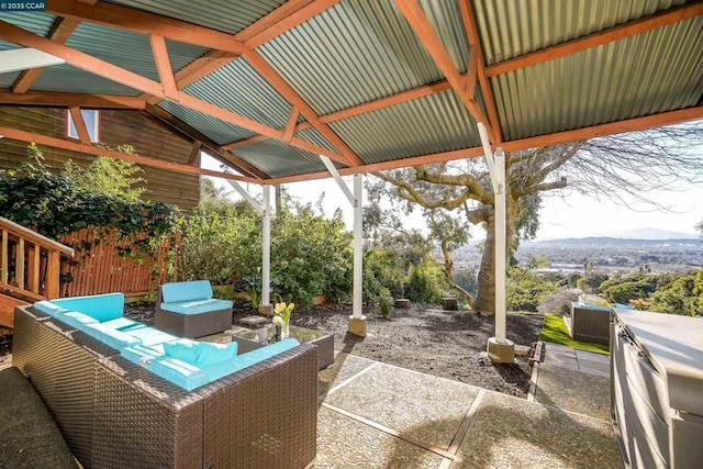 view of patio with outdoor lounge area and a mountain view