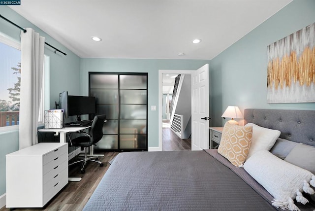 bedroom featuring dark hardwood / wood-style floors