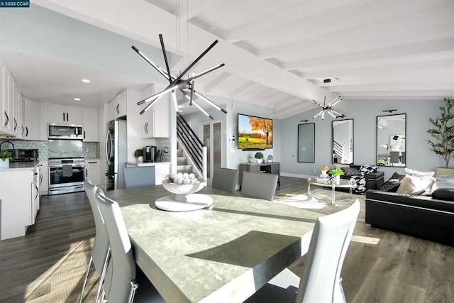 dining area with lofted ceiling with beams, dark wood-type flooring, and an inviting chandelier