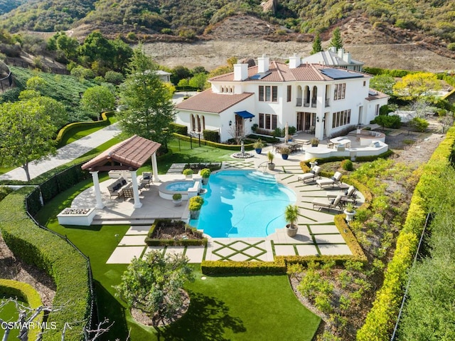 exterior space featuring a gazebo, a lawn, and a patio