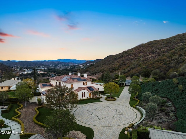 aerial view at dusk with a mountain view