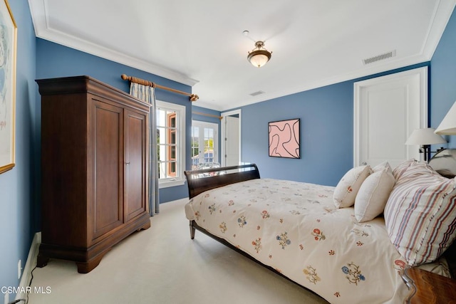 bedroom featuring ornamental molding and light carpet