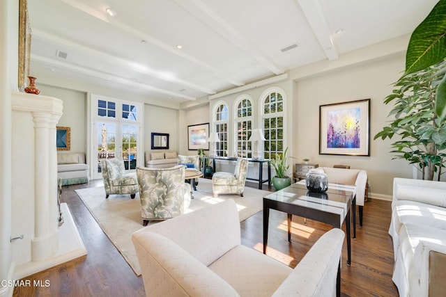 living room featuring beamed ceiling and wood-type flooring