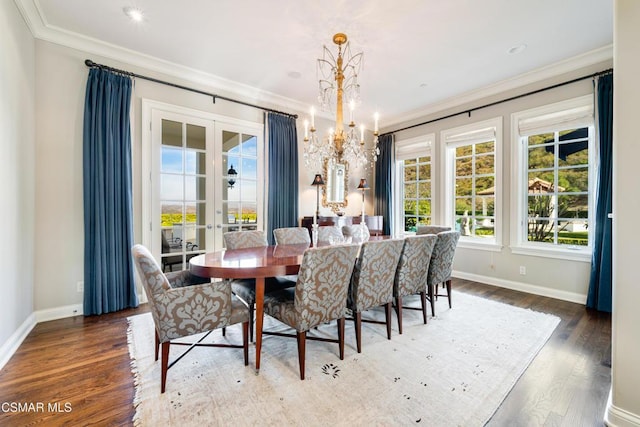 dining area featuring crown molding, dark wood-type flooring, french doors, and a chandelier