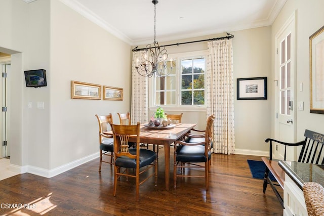 dining space with ornamental molding, dark hardwood / wood-style floors, and a chandelier