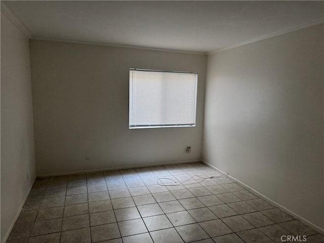 tiled empty room with crown molding