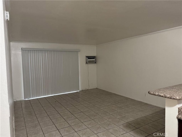 empty room with ornamental molding and a wall mounted air conditioner