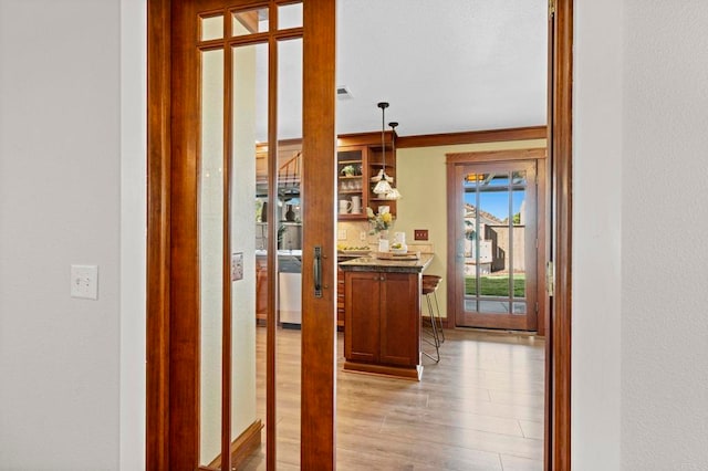 hall with light wood-type flooring