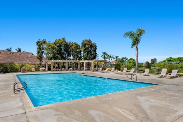 view of pool with a pergola and a patio area