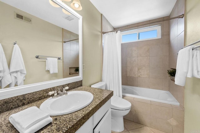 full bathroom with vanity, toilet, tile patterned floors, and shower / bath combo with shower curtain