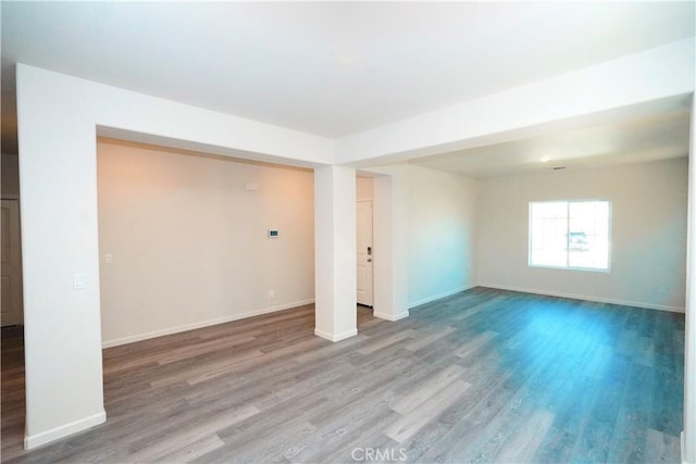 basement with hardwood / wood-style flooring