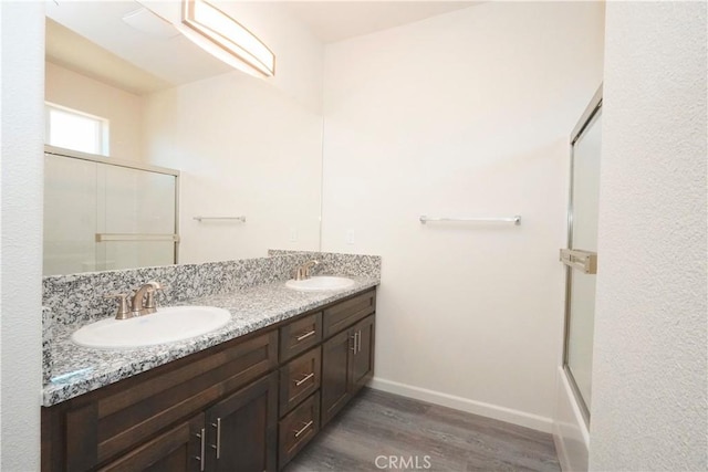 bathroom with vanity and wood-type flooring