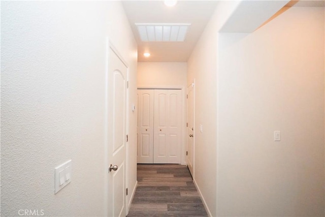 corridor featuring dark wood-type flooring