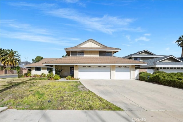 view of front of house with a garage and a front lawn