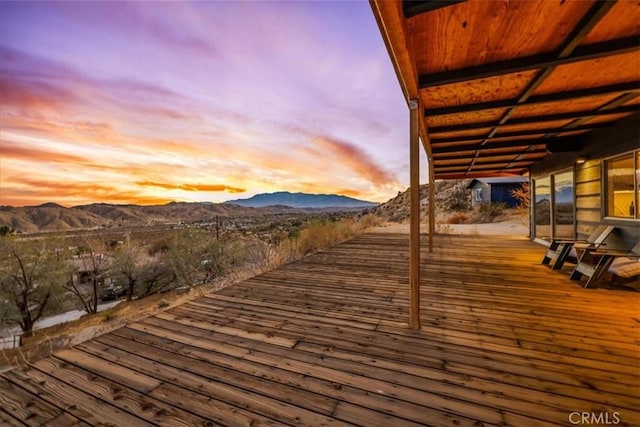 deck at dusk with a mountain view