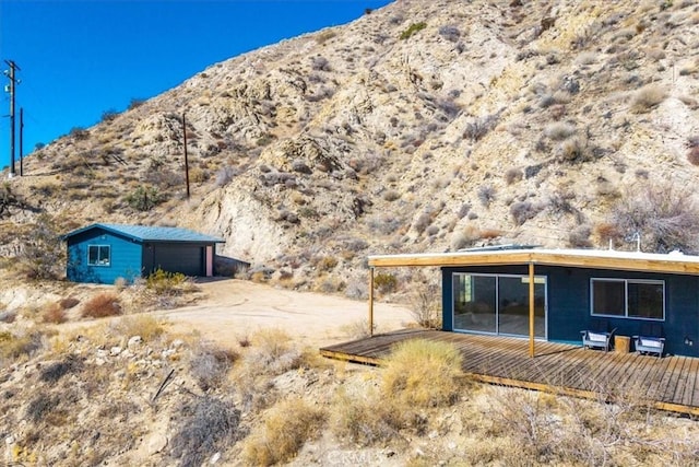 back of property featuring a mountain view