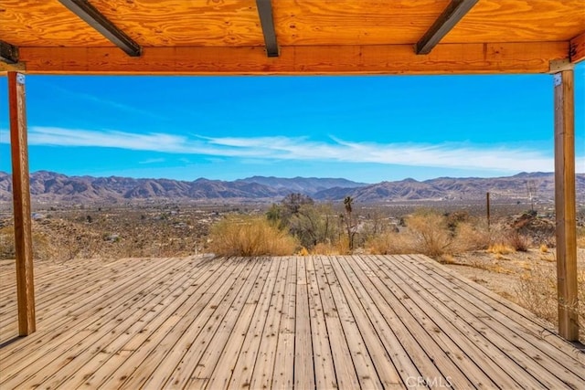 wooden terrace with a mountain view