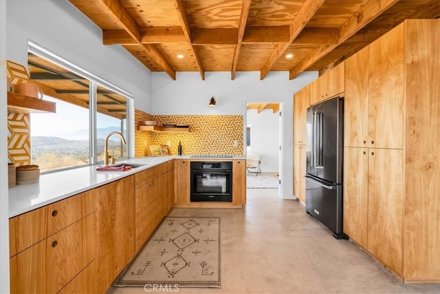 kitchen with sink, wooden ceiling, beamed ceiling, decorative backsplash, and black appliances