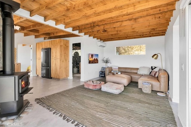 living room with beamed ceiling, a wood stove, a wall mounted air conditioner, and wooden ceiling