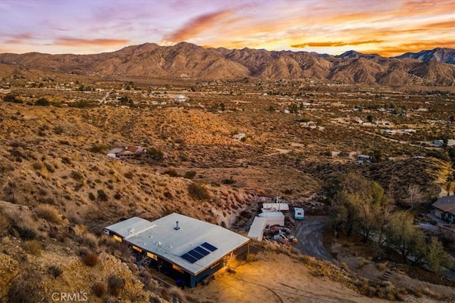 aerial view at dusk with a mountain view