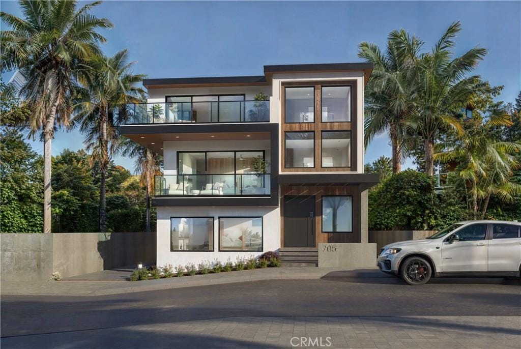 view of front of home with a balcony