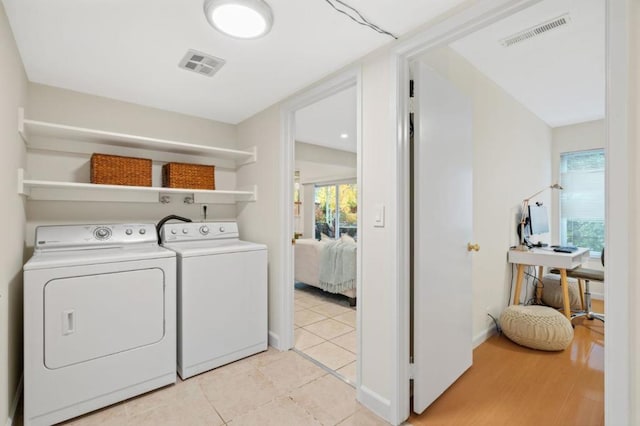 laundry room with independent washer and dryer