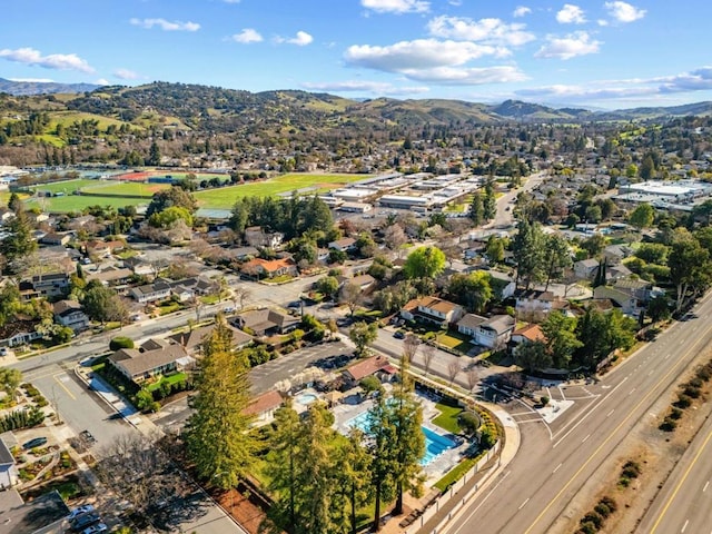 birds eye view of property with a mountain view