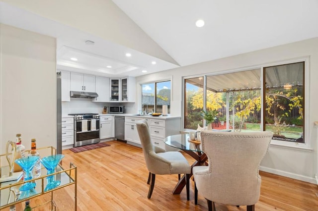 kitchen with white cabinetry, appliances with stainless steel finishes, and light wood-type flooring