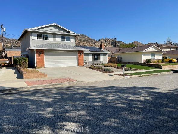 front facade with a garage