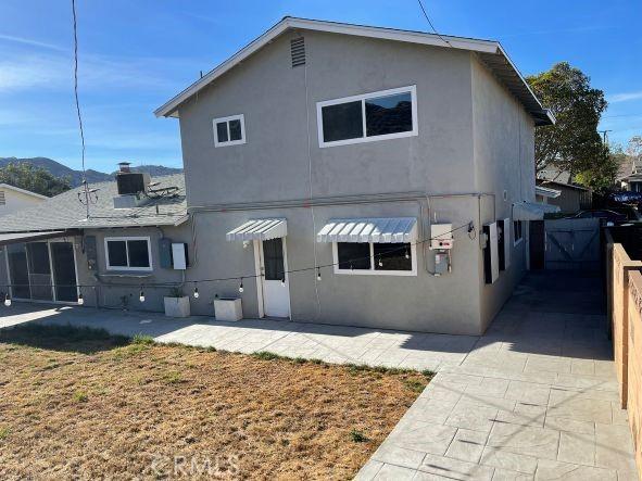 back of property with a patio area