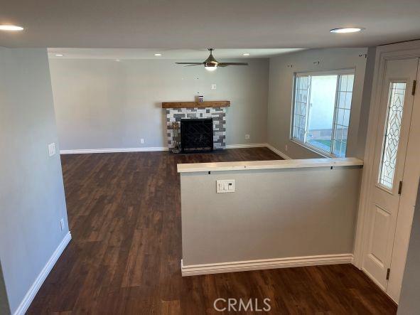 kitchen featuring ceiling fan and dark hardwood / wood-style flooring