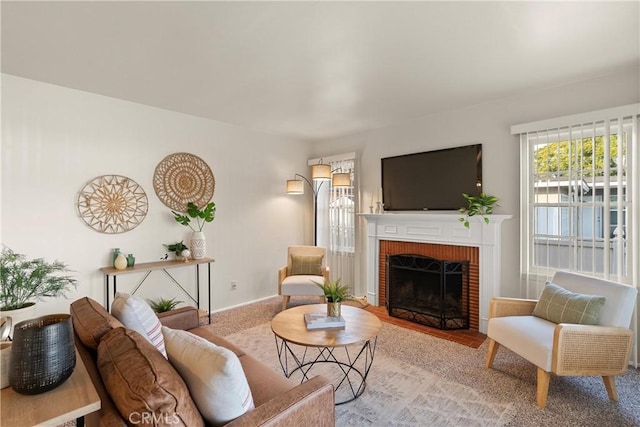 living room featuring carpet flooring and a fireplace