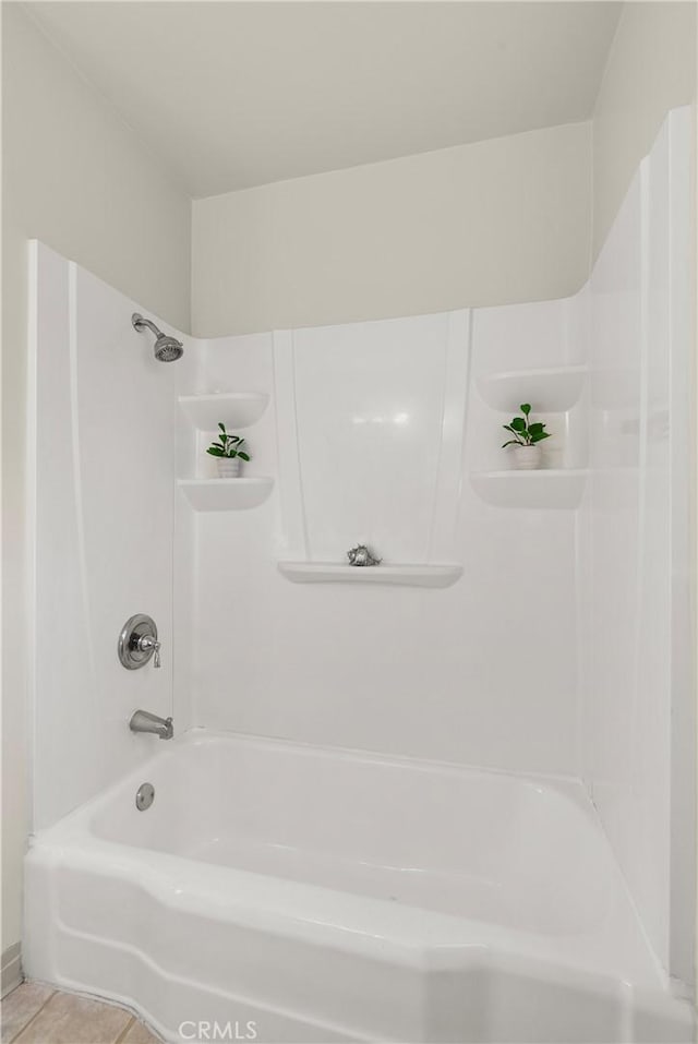 bathroom featuring shower / tub combination and tile patterned floors