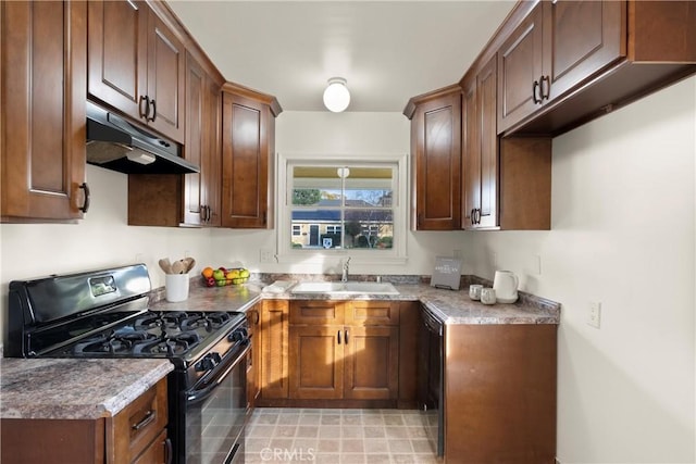 kitchen with dark stone countertops, sink, and black appliances