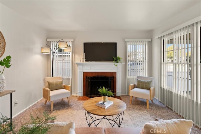 sitting room with carpet floors and a fireplace