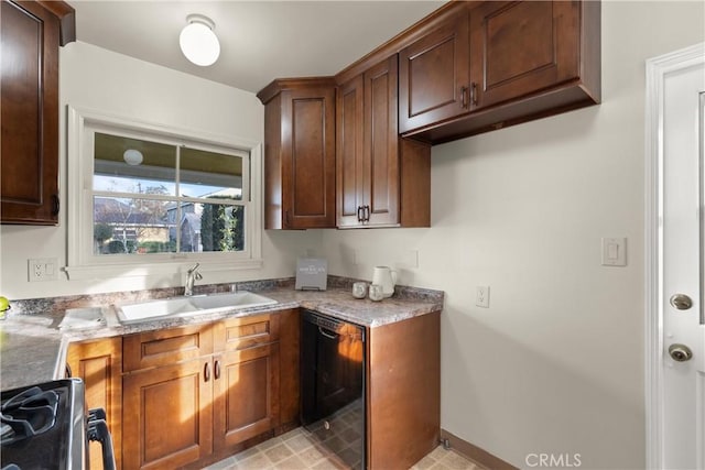 kitchen with sink, stainless steel range with gas cooktop, light stone countertops, and dishwasher