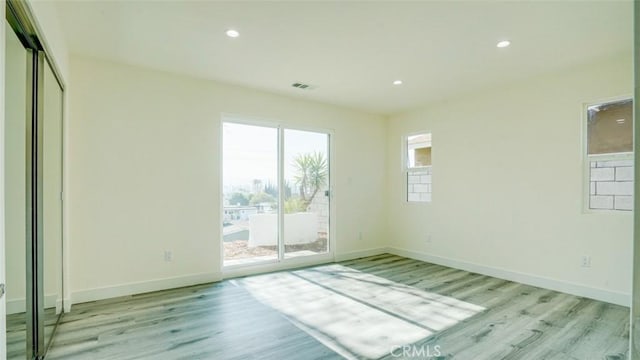 empty room with light wood-type flooring