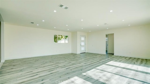 spare room featuring light wood-type flooring