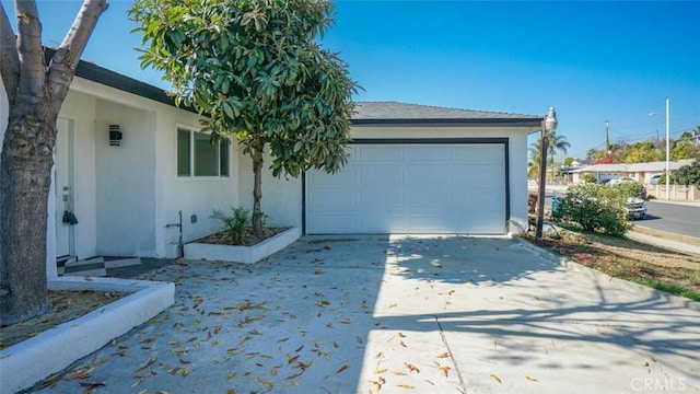 single story home featuring a garage