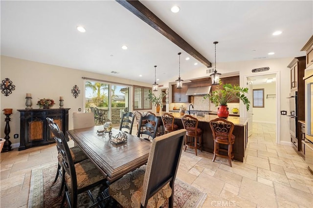 dining area featuring lofted ceiling with beams, recessed lighting, visible vents, baseboards, and stone tile flooring