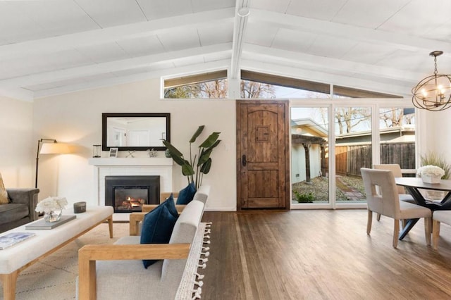 interior space with vaulted ceiling with beams, wood-type flooring, and a chandelier