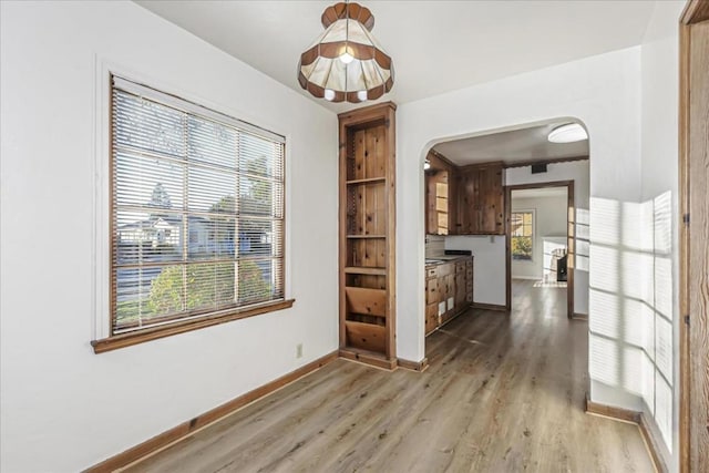 unfurnished dining area with hardwood / wood-style floors