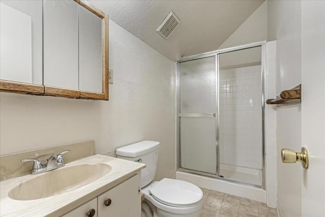 bathroom featuring vanity, toilet, an enclosed shower, and vaulted ceiling